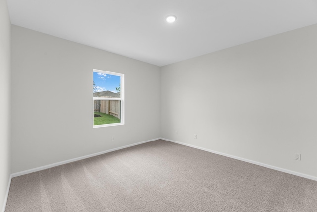 unfurnished room featuring carpet flooring