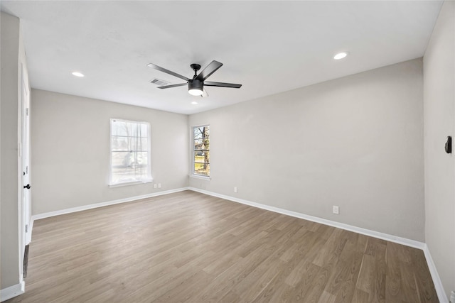 spare room featuring ceiling fan and light wood-type flooring