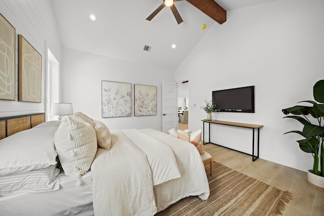 bedroom featuring ceiling fan, high vaulted ceiling, beam ceiling, and light hardwood / wood-style floors