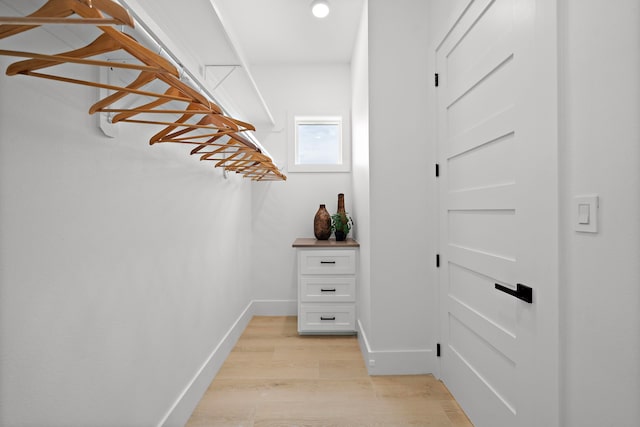 spacious closet featuring light hardwood / wood-style floors