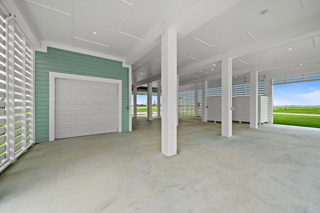 garage featuring wooden walls