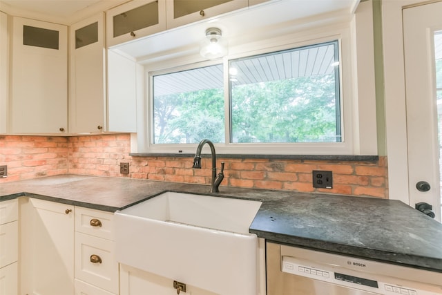 kitchen with white cabinetry, a healthy amount of sunlight, sink, and dishwasher