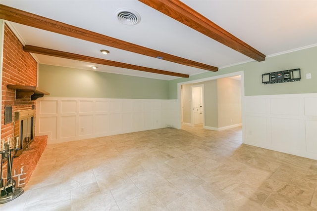 unfurnished living room with beam ceiling, crown molding, and a fireplace