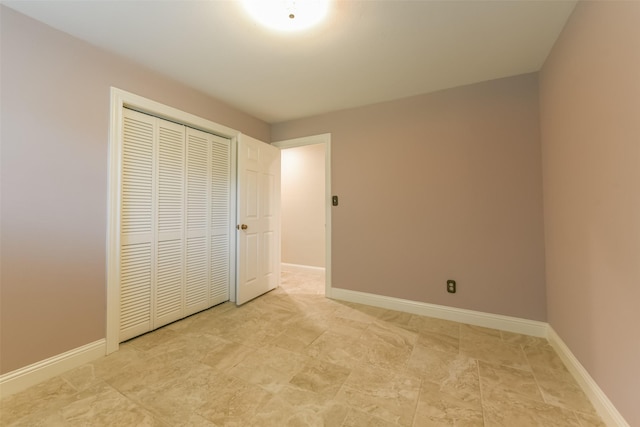 unfurnished bedroom with a closet