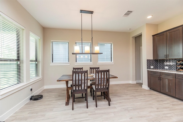 dining space featuring light hardwood / wood-style flooring