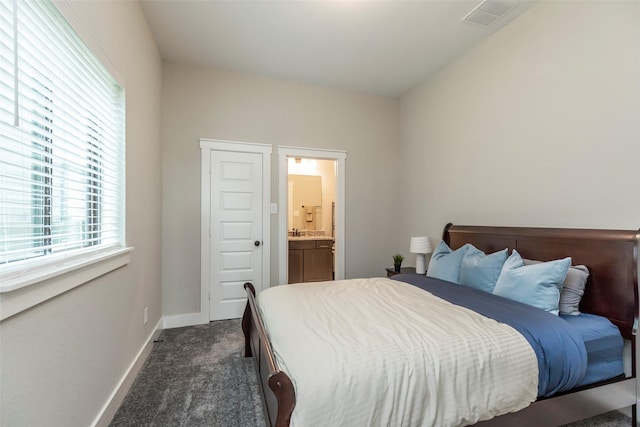 carpeted bedroom with ensuite bathroom