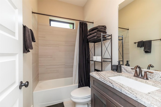 full bathroom featuring shower / tub combo with curtain, vanity, and toilet