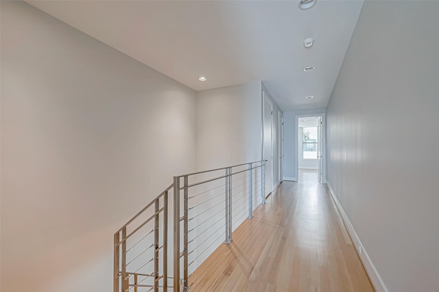 corridor with light wood-type flooring