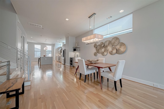 dining room with light hardwood / wood-style flooring