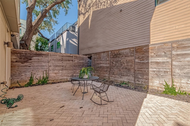 view of patio featuring fence