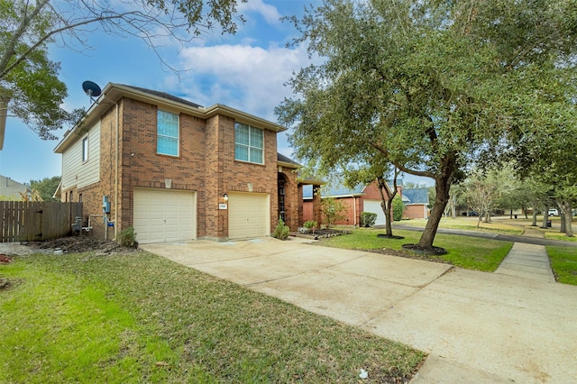 view of front of house with a garage and a front lawn