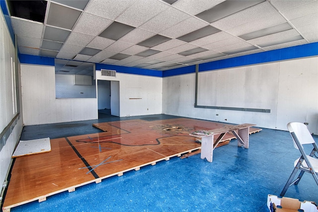 playroom featuring a paneled ceiling