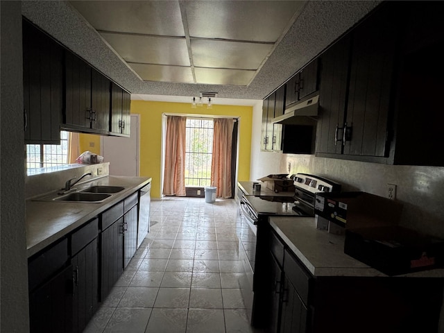 kitchen with light tile patterned flooring, sink, electric range, and white dishwasher