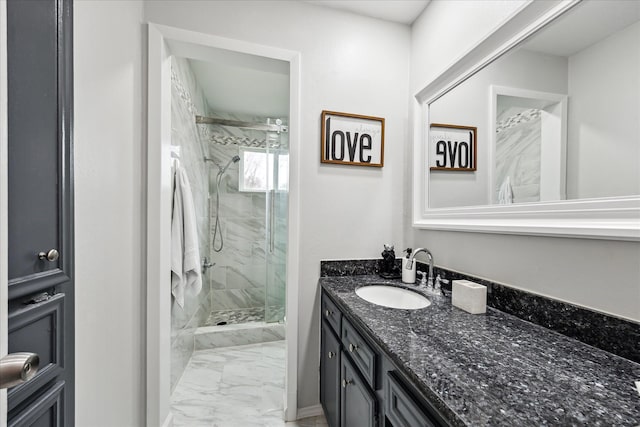 bathroom featuring vanity and a shower with shower door