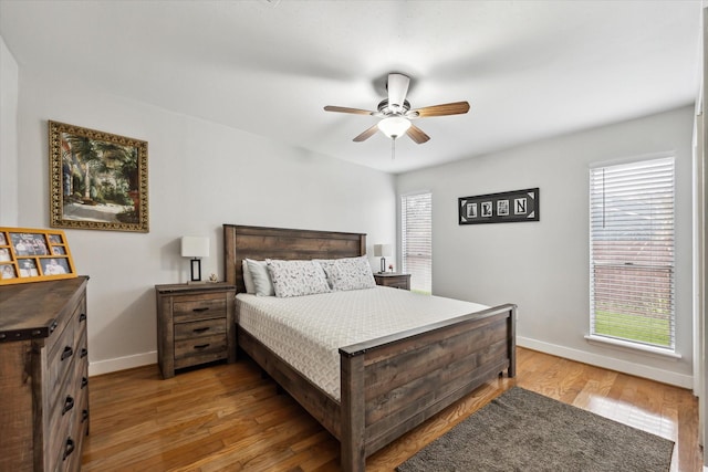 bedroom with wood-type flooring and ceiling fan