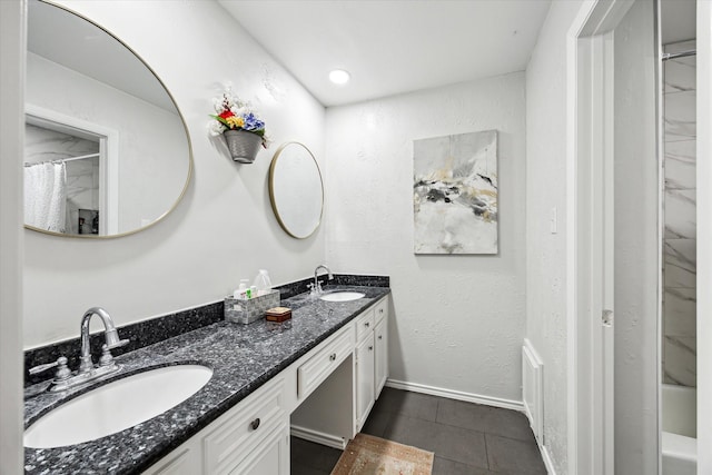 bathroom featuring vanity, tile patterned floors, and shower / tub combo with curtain