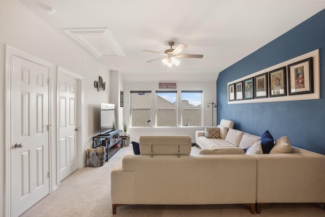 carpeted living room featuring ceiling fan