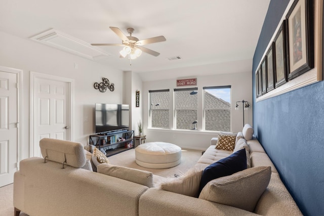 living room featuring carpet flooring and ceiling fan