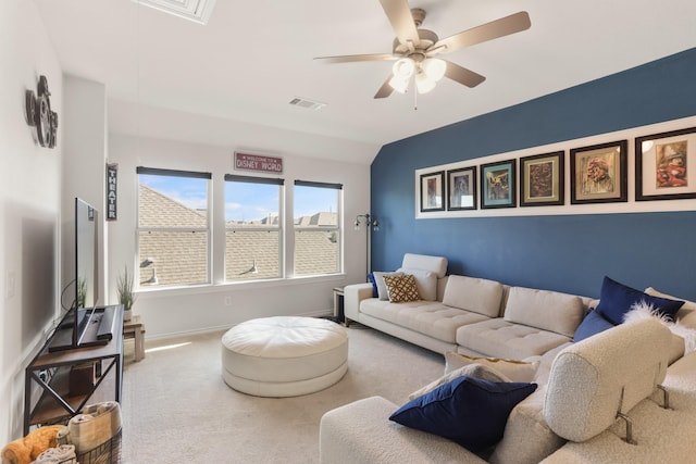 carpeted living room with lofted ceiling and ceiling fan