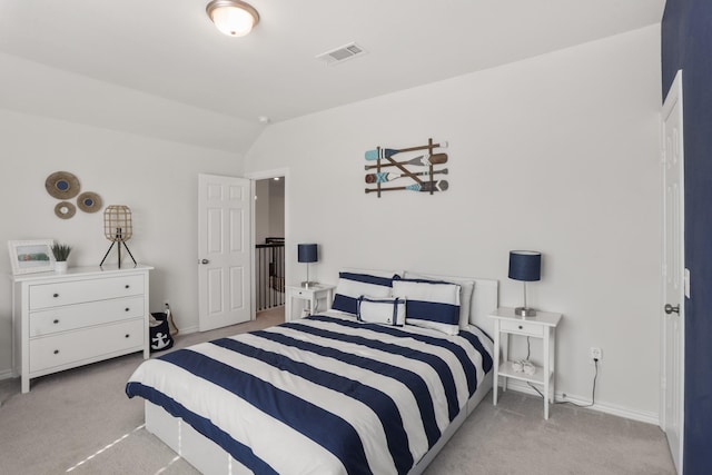 carpeted bedroom featuring vaulted ceiling