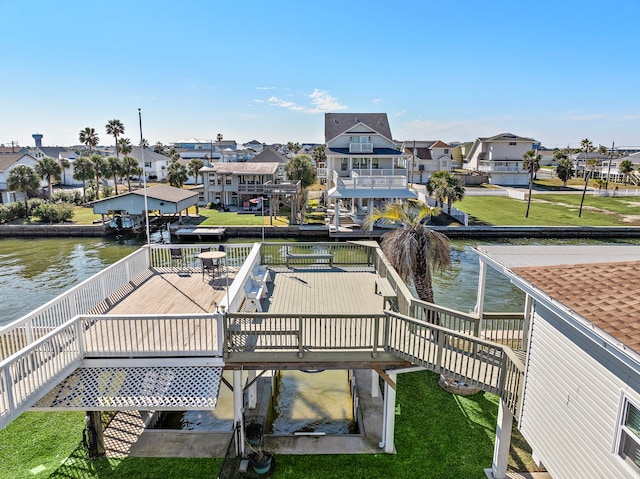 dock area featuring a deck with water view