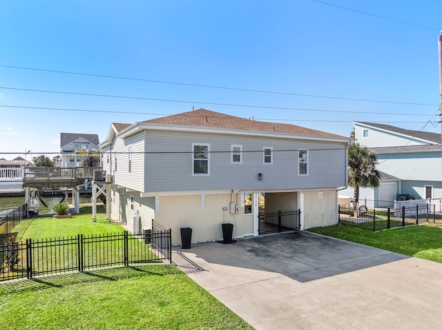 rear view of property featuring cooling unit and a yard