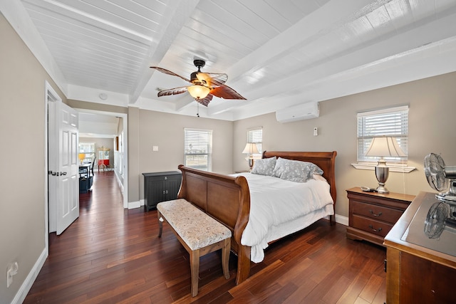 bedroom featuring dark wood-type flooring, ceiling fan, multiple windows, a wall mounted air conditioner, and beamed ceiling