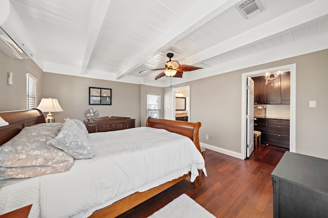 bedroom with ensuite bathroom, a wall mounted AC, dark hardwood / wood-style flooring, beamed ceiling, and ceiling fan with notable chandelier