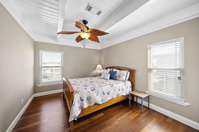 bedroom featuring beam ceiling, dark wood-type flooring, and ceiling fan