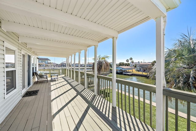 deck featuring a water view