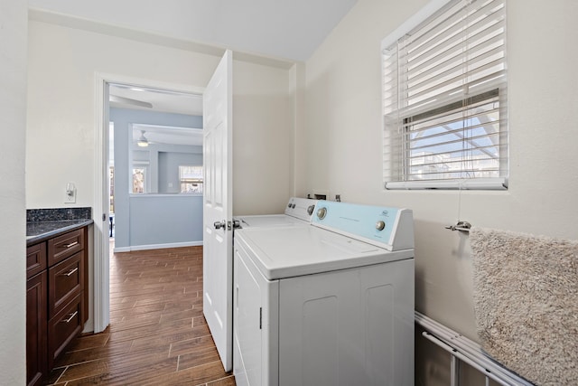 laundry area with washer and clothes dryer and a wealth of natural light