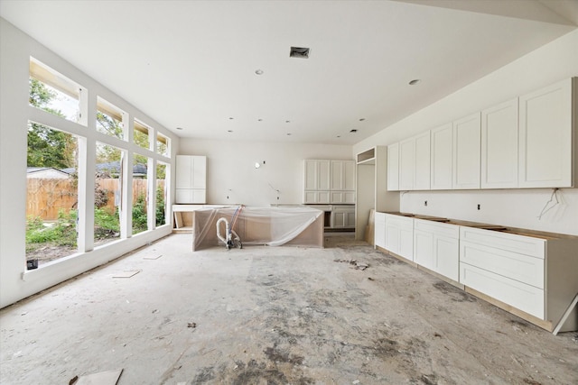 kitchen featuring white cabinetry and a center island