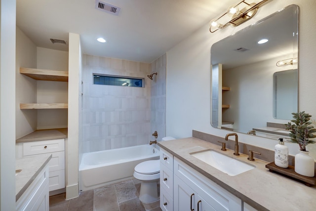 full bathroom featuring vanity, toilet, and tiled shower / bath combo