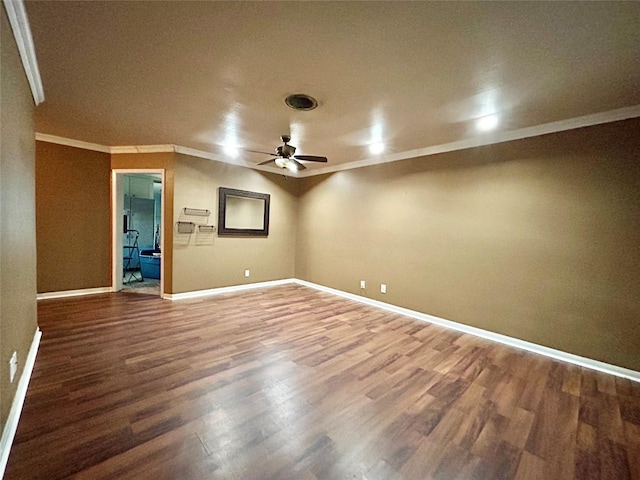 empty room featuring a ceiling fan, baseboards, wood finished floors, and ornamental molding