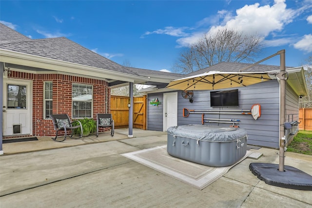 19475 Humaya, Porter, TX 77365 - view of patio / terrace featuring a hot tub, fence, and a gate
