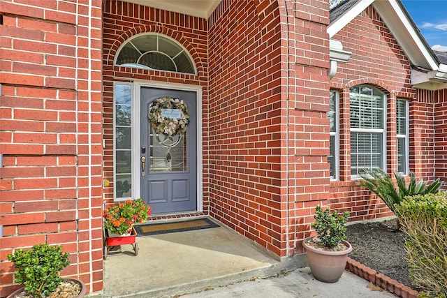 property entrance with brick siding