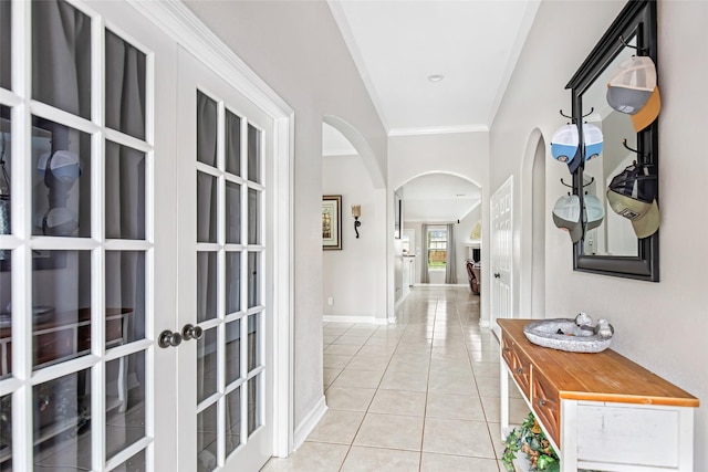 19475 Humaya, Porter, TX 77365 - hall with arched walkways, light tile patterned floors, crown molding, french doors, and baseboards