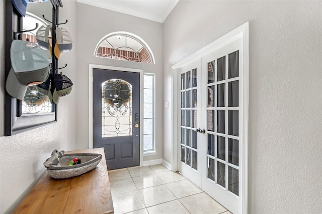 19475 Humaya, Porter, TX 77365 - entrance foyer featuring french doors, crown molding, light tile patterned floors, and a textured wall