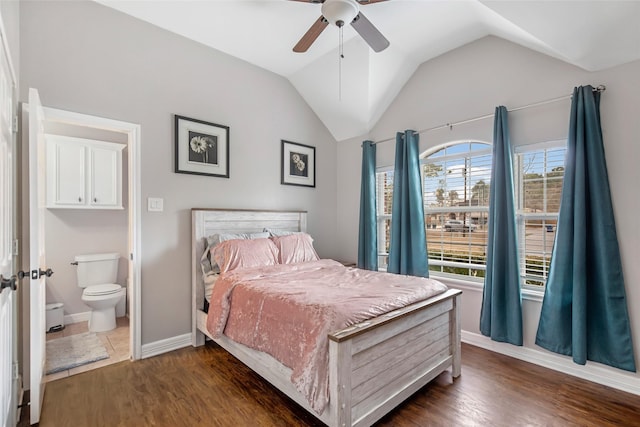 19475 Humaya, Porter, TX 77365 - bedroom with vaulted ceiling, dark wood finished floors, baseboards, ceiling fan, and connected bathroom
