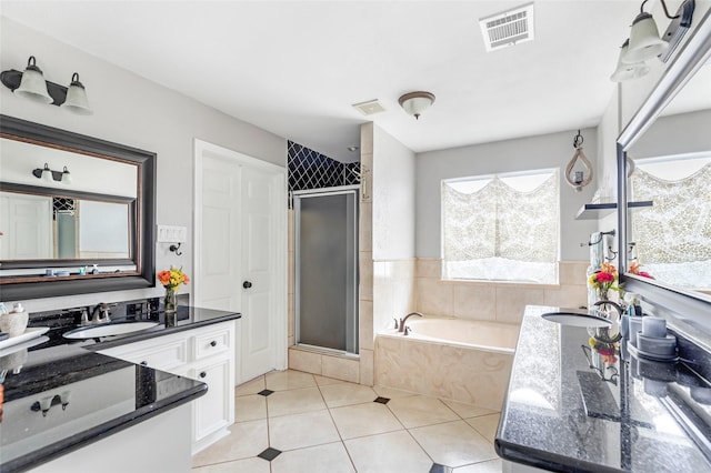 19475 Humaya, Porter, TX 77365 - bathroom featuring a shower stall, tile patterned flooring, a bath, and vanity