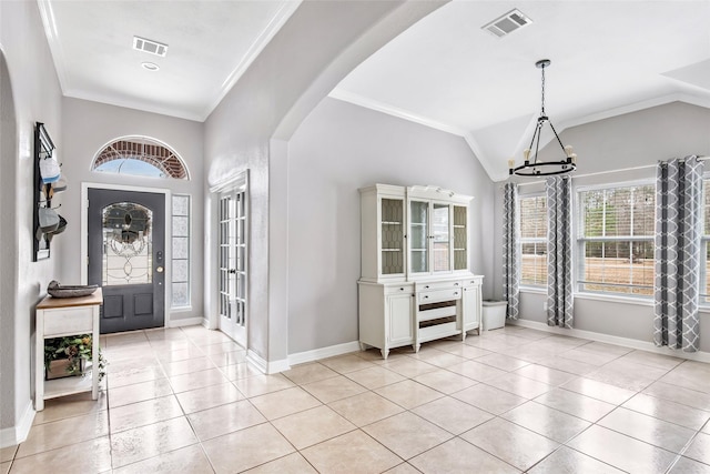 19475 Humaya, Porter, TX 77365 - entryway featuring a chandelier, arched walkways, healthy amount of natural light, crown molding, and vaulted ceiling