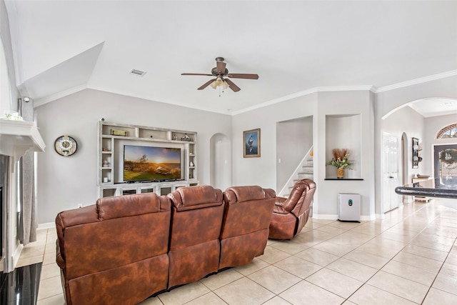19475 Humaya, Porter, TX 77365 - living room featuring arched walkways, light tile patterned floors, a ceiling fan, stairway, and crown molding