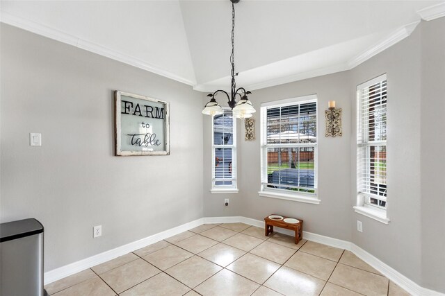 19475 Humaya, Porter, TX 77365 - unfurnished dining area with a chandelier, baseboards, light tile patterned floors, ornamental molding, and vaulted ceiling