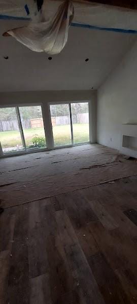 empty room with vaulted ceiling