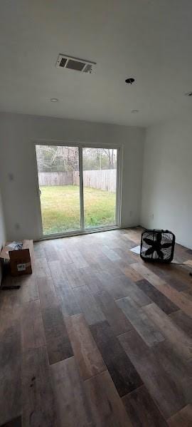 empty room featuring wood-type flooring