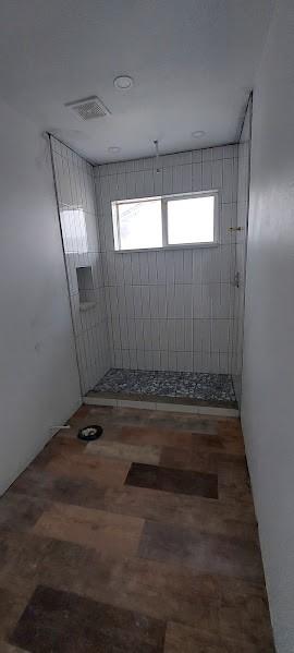 bathroom featuring walk in shower