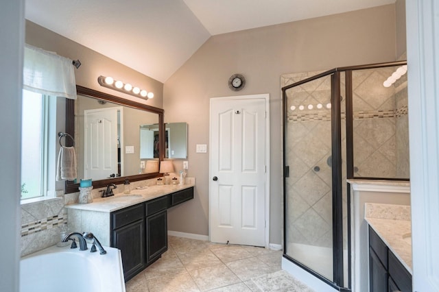 bathroom with lofted ceiling, vanity, separate shower and tub, and tile patterned floors