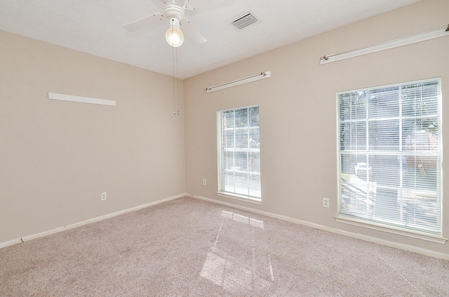 unfurnished room with carpet floors and ceiling fan