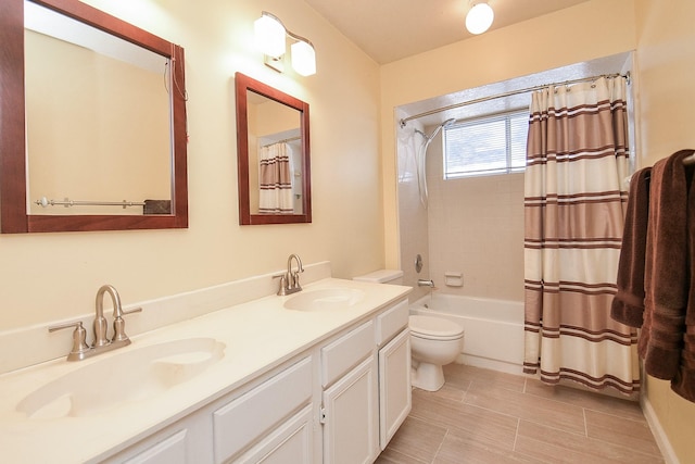 full bathroom with vanity, shower / bathtub combination with curtain, and toilet