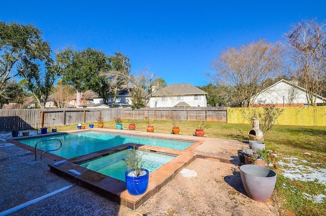 view of pool with a lawn